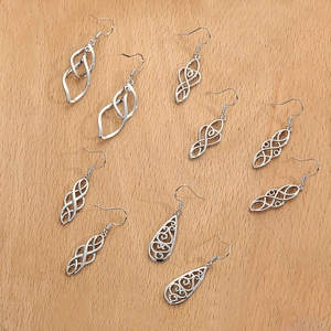 Detailed set of five vintage silver-plated Celtic knot and hollow geometric drop earrings