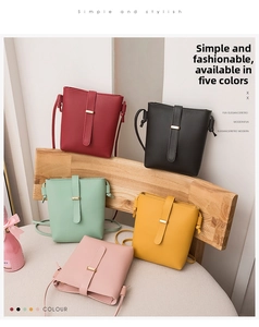 Collection of minimalist crossbody bucket bags in five colors including pink and green.