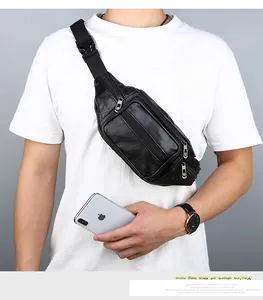 Detail of black leather chest bag with multiple silver zippers and adjustable strap