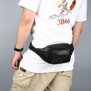 Black leather waist bag with multiple zippers and adjustable strap for men on model