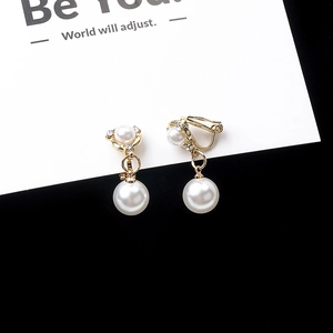 Exquisite gold windmill pearl drop earrings with sparkling rhinestones on white card