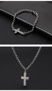 Detail of vintage silver cross necklace and bracelet with industrial hammered texture
