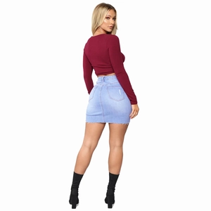 Women's burgundy knit crop top and distressed denim mini skirt set with ankle boots