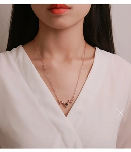 Rose gold antler necklace for women with crystal accents on an elegant O-chain