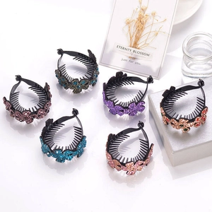 Detail view of bird's nest hair clips featuring sparkling crystal flower decorations