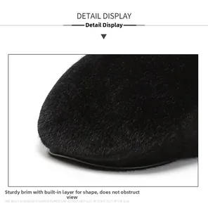 Macro detail of firm black hat brim with thick velvet fabric and reinforced stitching