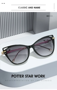 Close-up of cat-eye sunglasses with purple gradient lenses and gold butterfly metal details