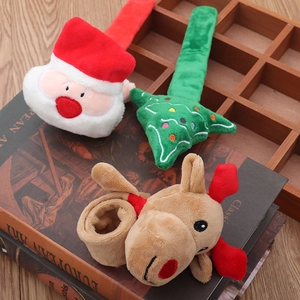 Detailed view of plush Christmas slap bracelets featuring Santa Claus, reindeer, and tree