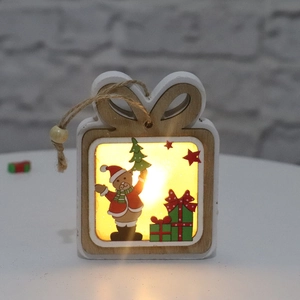 Close-up of a wooden glowing Christmas gift box ornament with warm yellow LED lights inside