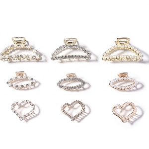 Set of 9 gold geometric hair claws with pearls and rhinestones in various shapes