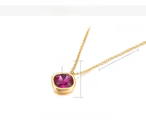 Detailed view of square purple zircon pendant on 13mm stainless steel gold chain necklace