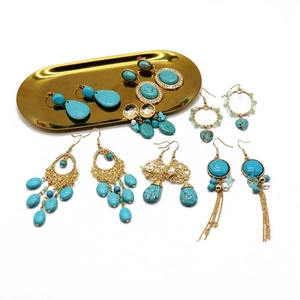 Detailed collection of bohemian turquoise earrings with gold tassels and vintage designs