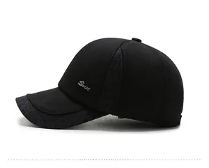 Detail view of winter baseball cap showing thick fabric, grey tweed and Sport metal logo