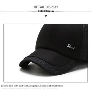Detail view of winter baseball cap with grey textured brim and white Sport embroidery