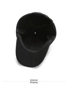 Detailed interior view of black wool baseball cap showing stitching and inner lining