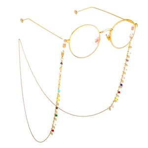 Occhiali rotondi dorati alla moda con catena di perline colorate e cordino antiscivolo