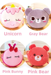 Macro detail of four plush cartoon kids purses with fine embroidery and soft texture