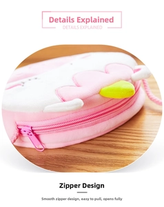 Close-up of the smooth pink zipper closure on a soft plush cartoon unicorn bag