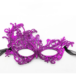 Close-up of fuchsia thick lace phoenix mask with intricate hollow-out floral patterns