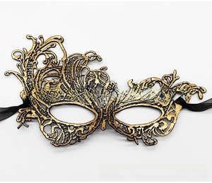 Detailed view of the bronzed gold lace masquerade mask with ornate cutout patterns