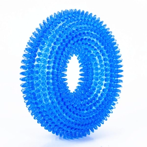 Close-up of durable blue TPR dog chew ring featuring textured spikes for teeth cleaning
