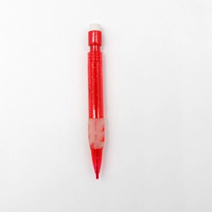 Detailed shot of red mini mechanical pencil with glitter barrel and soft rubber grip