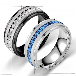 Detail of 8mm titanium steel rings featuring brushed texture and micro-paved stones