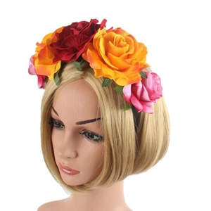Detailed view of Halloween headband with red, orange and pink velvet roses on a model