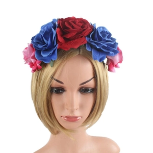 Detailed front view of Mexican party headband with red and blue fabric rose flowers