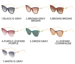 Detailed close-up showing seven stylish cat-eye sunglasses with gold butterfly metal temples