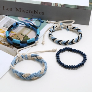 Four-piece punk set of braided leather, linen ropes and blue wooden beads bracelets