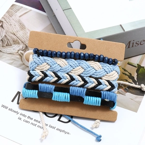Handmade 4-piece multi-layer bracelet set with blue wooden beads and woven leather