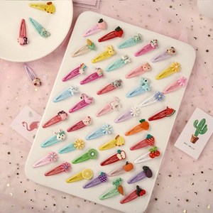 Close-up of colorful candy color BB hair clips with cute resin fruit and animal patterns