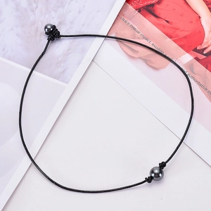 Minimalist black leather cord necklace featuring two dark grey round pearls in a modern style