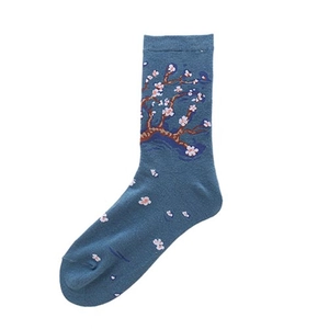 Detailed macro view of dark blue socks featuring Vincent van Gogh style floral embroidery