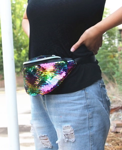 Close-up of rainbow sequin fanny pack with colorful gradient and black adjustable strap