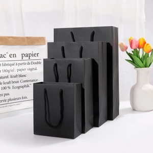 Sacchetti regalo in carta kraft nera opaca con manici in nylon in quattro varie misure