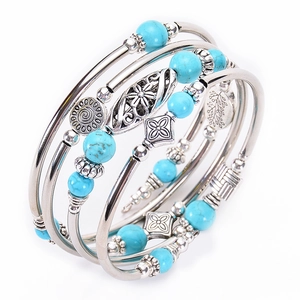 Multi-layer wrap bracelet with natural turquoise beads and vintage silver floral charms