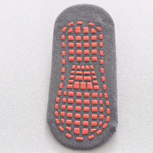 Grey non-slip socks with orange silicone grips for toddlers' walking and yoga safety