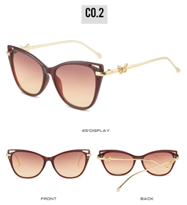 Three angles of burgundy cat-eye sunglasses with gold butterfly metal temples and gradient lenses