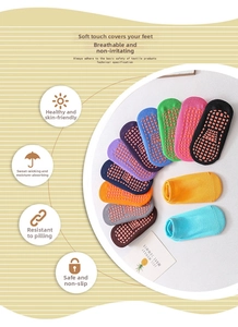 Detail of anti-slip silicone grippers on cotton baby socks for safety and walking