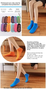 Macro detail of anti-slip silicone dots on colorful cotton baby floor socks for grip