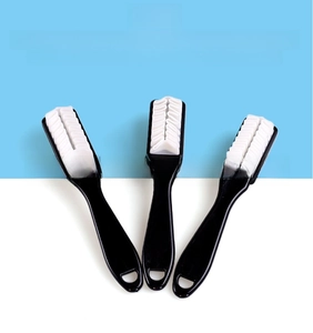 Three-pack of multi-functional suede shoe brushes with wavy rubber heads and black handles