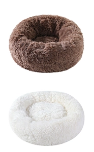 Detail of plush round donut pet bed featuring deep brown and cream faux fur texture
