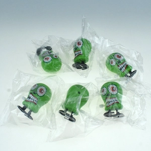 Set da sei pezzi di carillon a forma di testa di zombie verde in buste di plastica