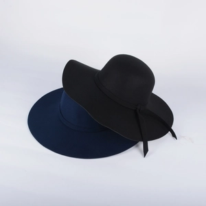 Detail of wide brim wool felt hats in black and navy blue with matching ribbon bands