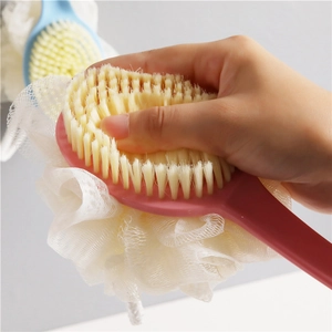 Pink long handle dual-sided bath brush with soft bristles and white exfoliating shower loofah