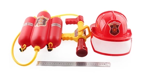 Detailed view of children fire fighter set with water backpack and gun next to a ruler