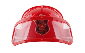 Close-up of a red children's firefighter helmet with transparent visor and badge