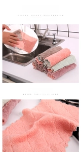 Close-up of thick coral velvet kitchen towel with wavy edges and absorbent fiber texture